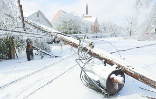 A untility pole and transformer lie in a road in Wednesday, Jan. 28, 2009 in Mountain Home, Ark. Ice and snow pelted northern Arkansas, Tuesday causing widespread power outages.